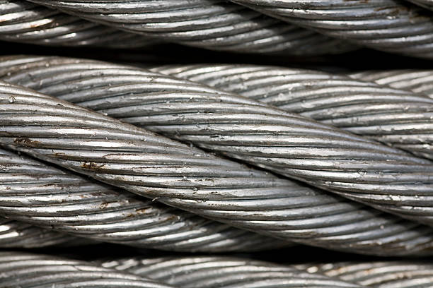 macro de grosor de cable metálico - rope intertwined large silver fotografías e imágenes de stock