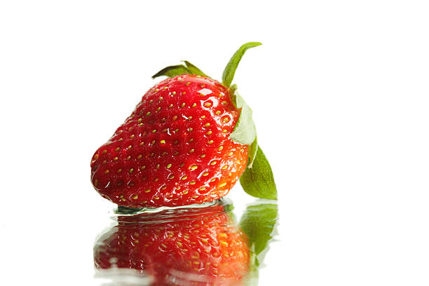 Fresh Strawberry, with dew drops isolated on white