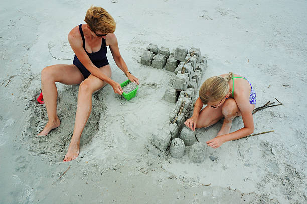 istock Mother and Daughter Building Sand Castle 172852807