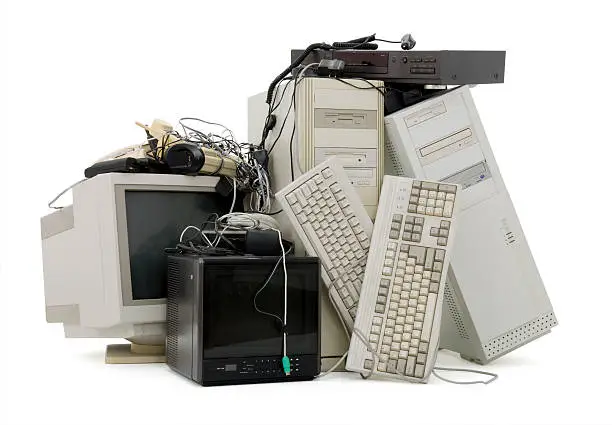 Photo of A pile of old keyboards, hard drives and monitors