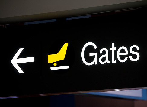 Sign directing passengers to the departure gates.