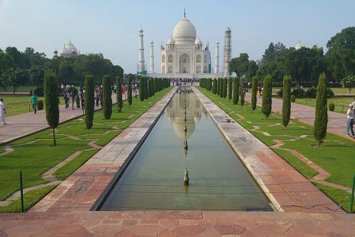 The Taj Mahal is an ivory-white marble mausoleum on the right bank of the river Yamuna in Agra, Uttar Pradesh, India.