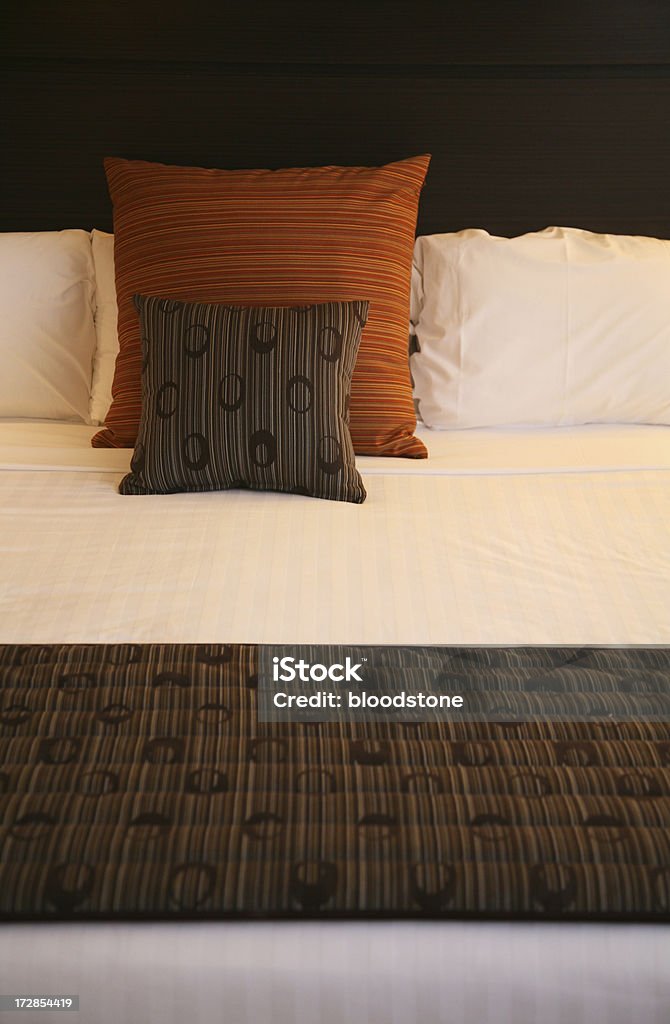 Bed Bed made up with cushions Bed - Furniture Stock Photo