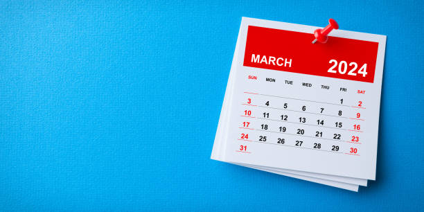 white sticky note with 2024 march calendar and red push pin on blue background - march past imagens e fotografias de stock