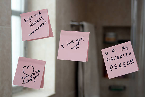 Love notes on sticky paper stuck up on a mirror Love notes on the bathroom mirrorPlease see my similar photos: i love you stock pictures, royalty-free photos & images