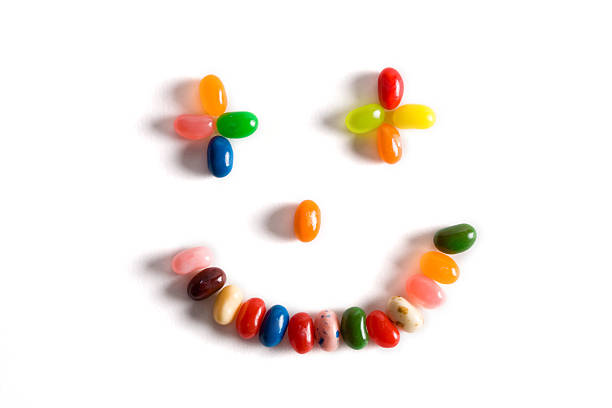 Happy Face made from Jelly beans Studio picture of a happy face made out of jelly beans. gummy candy photos stock pictures, royalty-free photos & images