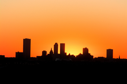Silhouette of the Tulsa, Oklahoma skyline at dawn with copy space.