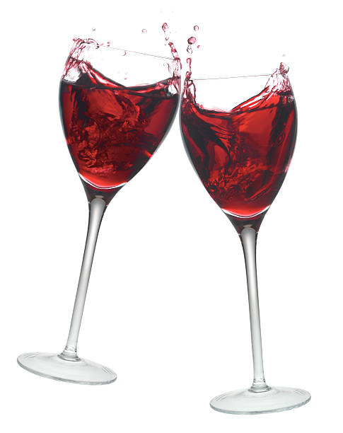 istock Red wine glasses in toast gesture. 172858547