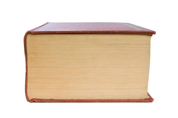 A bottom view of a very large dictionary. Isolated against a pure white background.