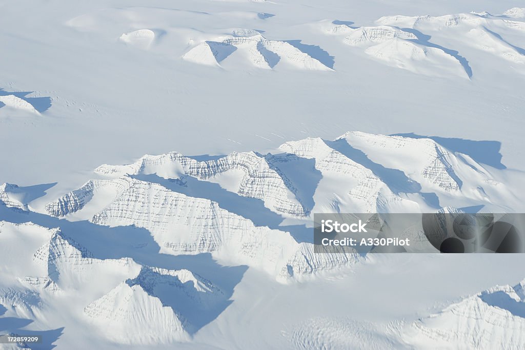 Polar Ice Aerial view of the mountains and ice cap/glaciers of Greenland. 72 degrees North. North Pole Stock Photo