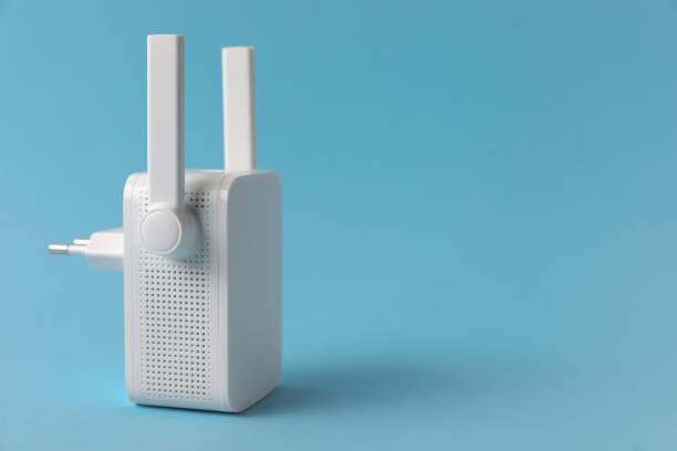 istock New modern Wi-Fi repeater on light blue background, space for text 1728595093