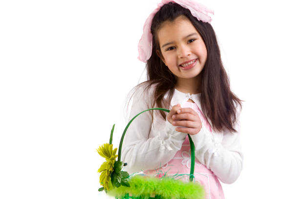 Beautiful young girl with Easter basket. Pink bow in hair. CLICK FOR SIMILAR IMAGES AND LIGHTBOX WITH MORE CHILDREN.