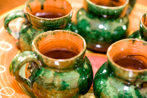Closeup of a set of ceramic mugs.