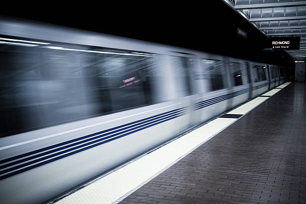 BART Arriving A BART train pulls into a station in the east bay alameda county stock pictures, royalty-free photos & images