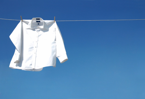 Picture of a white long sleeve shirt drying out on the sun.See Also: