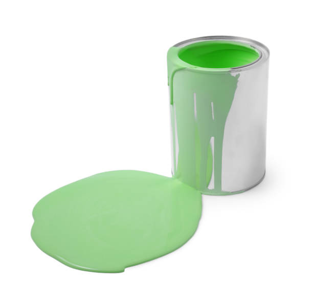 istock Spilled light green paint and can on white background 1728629515