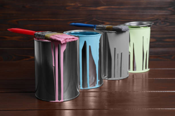 istock Cans of paints and brushes on wooden table 1728631208