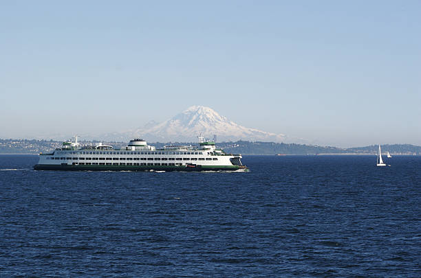 A Washington State ferry on Puget Sound with Mt. Rainier far in the background