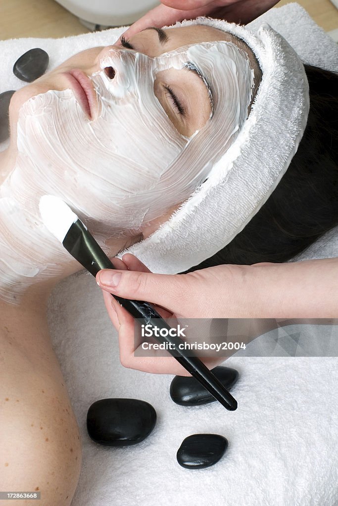 Facemask woman having a facemask applied 16-17 Years Stock Photo
