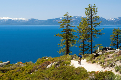 Mountain biking with Lake Tahoe in the background.
