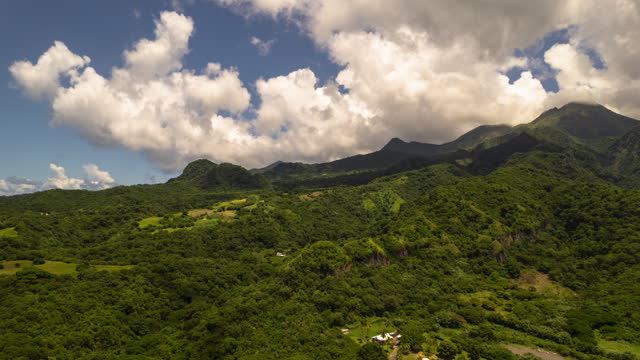 Hyperlapse of mount Pelée in Martinique with fast moving clouds and a blue sky