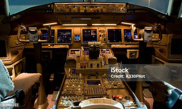 High Tech Airplane Cockpit At Night Stock Photo - Download Image Now - Cockpit, Dark, Aerospace Industry