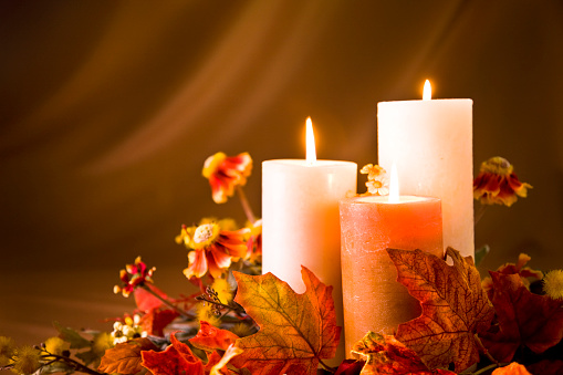 Candles against a golden backdrop for your autumn theme.