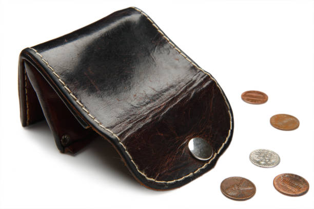 Empty old leather wallet and small change stock photo