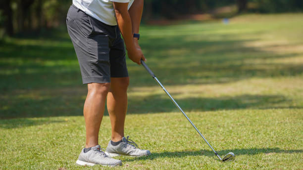 istock Golfer playing golf in the evening golf course, on sun set evening time. 1728659378