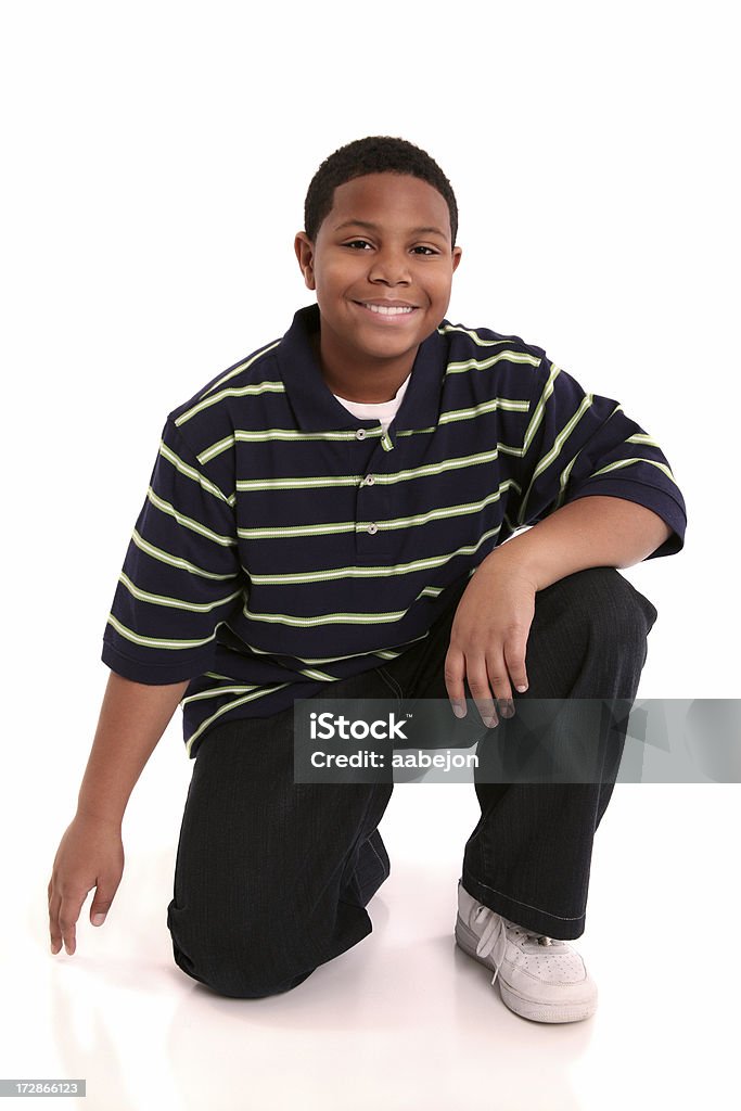 On One Knee Young boy smiling.  Other images of this boy in my portfolio: 10-11 Years Stock Photo