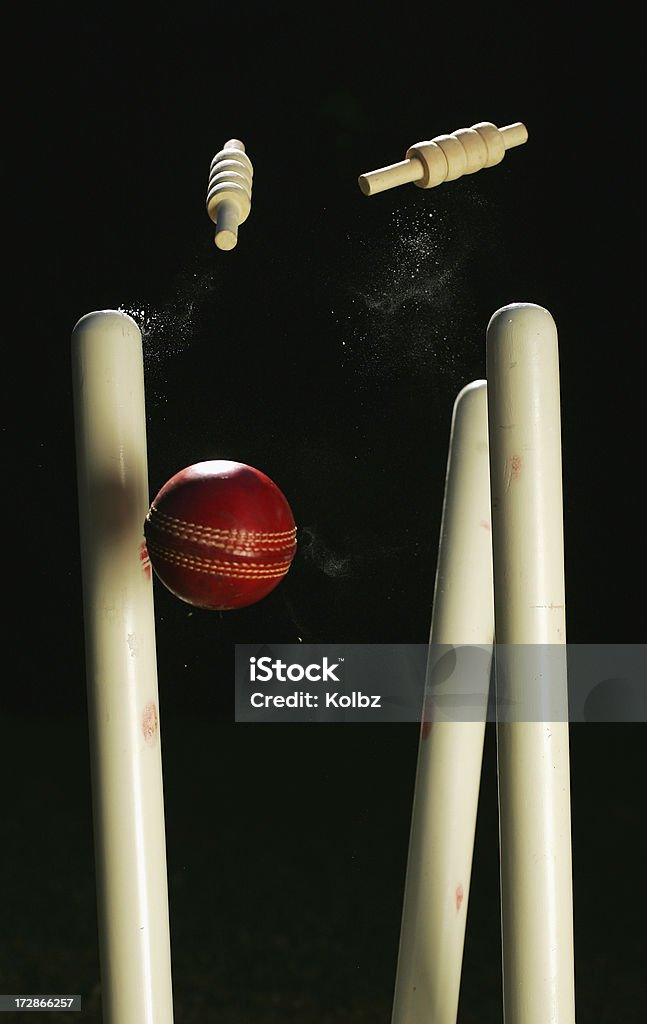 Cricket Stumps A cricket ball crashes through a set of stumps Sport of Cricket Stock Photo