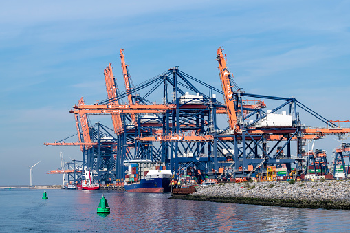 Rotterdam, the Netherlands-September 16, 2023; Various container ships in front of the container terminal with cranes loading or onloading containers at Hutchison Ports ECT Euromax