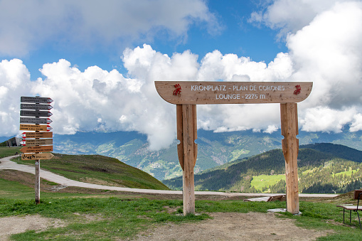 Riscone, Kronplatz, Italy-June 14, 2023; Directional signs and signage of Kronplatz mountain in the Dolomites, South Tyrol, northern Italy, with a summit elevation of 2,275 metres above sea level