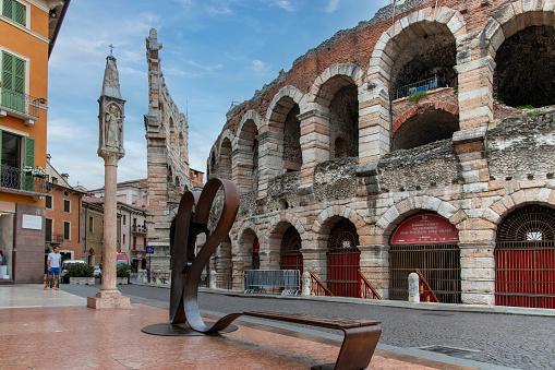Verona, Italy-June 13, 2023; Symbolic Heart monument on Piazza Bra in front of the ancient Verona Arena which is a Roman amphitheatre built in 30 AD