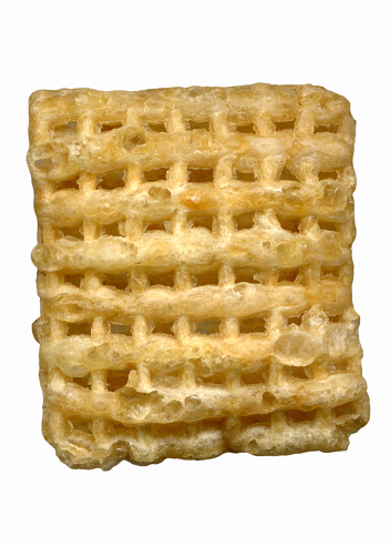 Close-up of a piece of rice chex cereal.