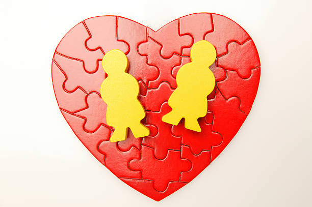 istock heart puzzle with two people shape on it 172867672