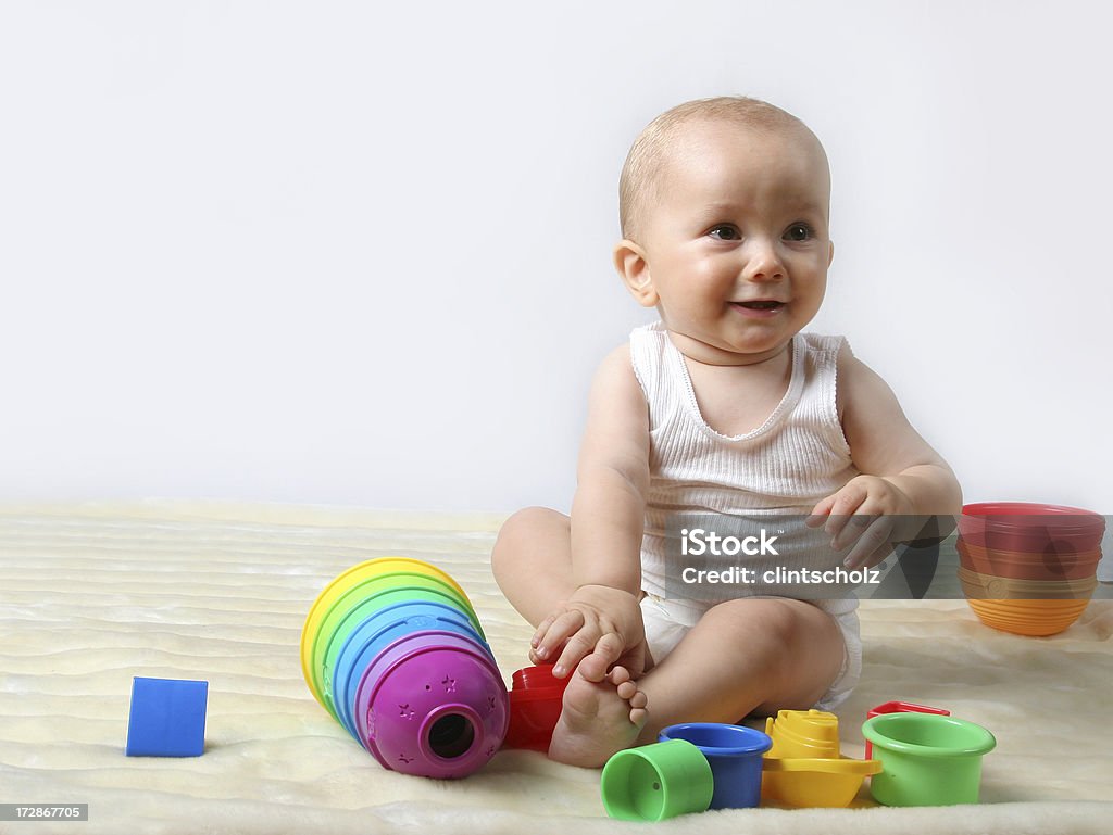Playtime A beautiful young boy playing with his toys 6-11 Months Stock Photo