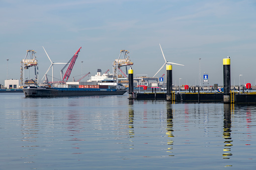 Rotterdam, the Netherlands-September 16, 2023; Inland vessel entering Prinses Margriethaven on Tweede Maasvlakte extension of Europoort port and industrial facility next to APM Terminal and Futureland