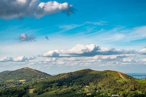 Herefordshire Beacon looking northwards,down towards the Malverns hill range,from the summit of the Iron Age hill fort,on a fine summertime afternoon,.