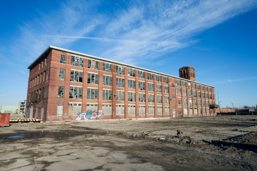 Old broken empty abandoned industrial building interior.