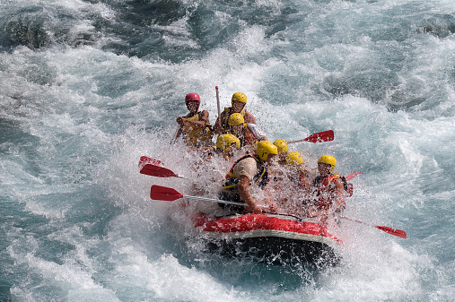 Red raft in violent white water