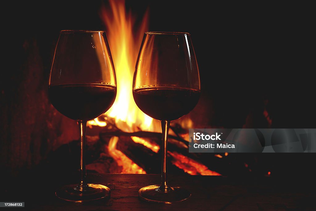 Wine and fire Cups of red wine by a fire.Many more like this at Vineyard & Wine Lightbox  (cick on any photo to open) Drink Stock Photo