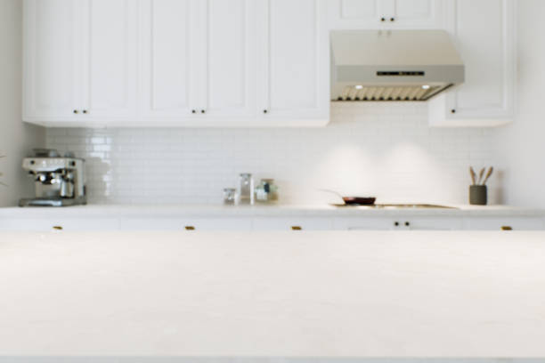 istock Macro focus on kitchen countertop for product presentation and advertising. White kitchen with marble surface and blurred background. 3D visualization 1728681962