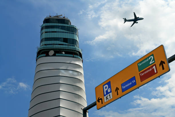 The top storey of the air traffic control tower of Sydney Kingsford-Smith Airport. This image was taken from Mill Stream Lookout, Botany Bay on an overcast afternoon approaching sunset on 25 May 2024.