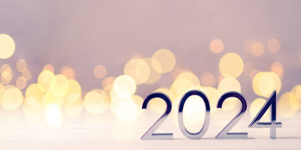 istock Metal numbers 2024 on table with bokeh lights. 1728683685