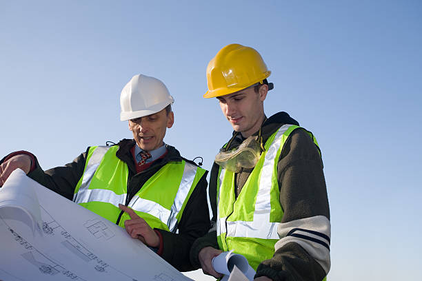 Architect / Surveyor and Builder -- Site Inspection - XLarge stock photo