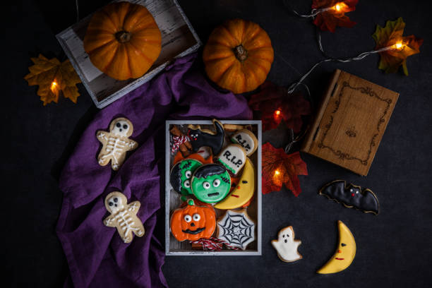 istock Fresh halloween cookies on black background 1728684893