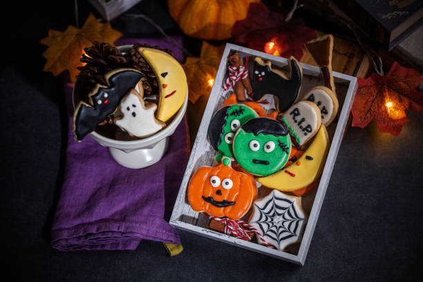 istock Fresh halloween cookies on black background 1728684894