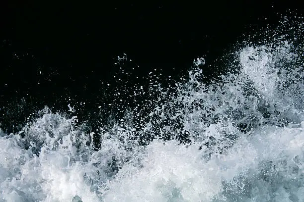 Intense white water spray against a black background. Perfect for compositing.