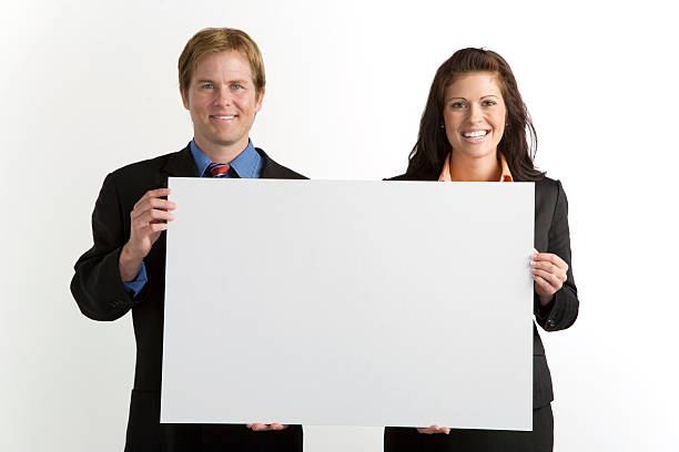 istock Business Couple Holding Blank Sign 172868786